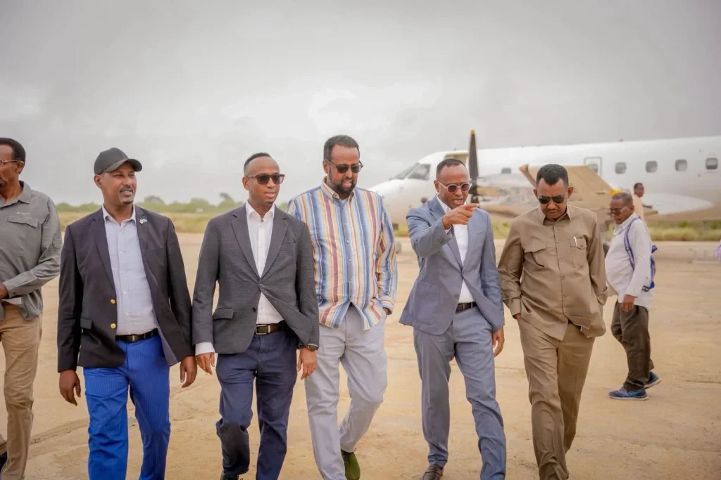 Officials walking across an airstrip in Somalia